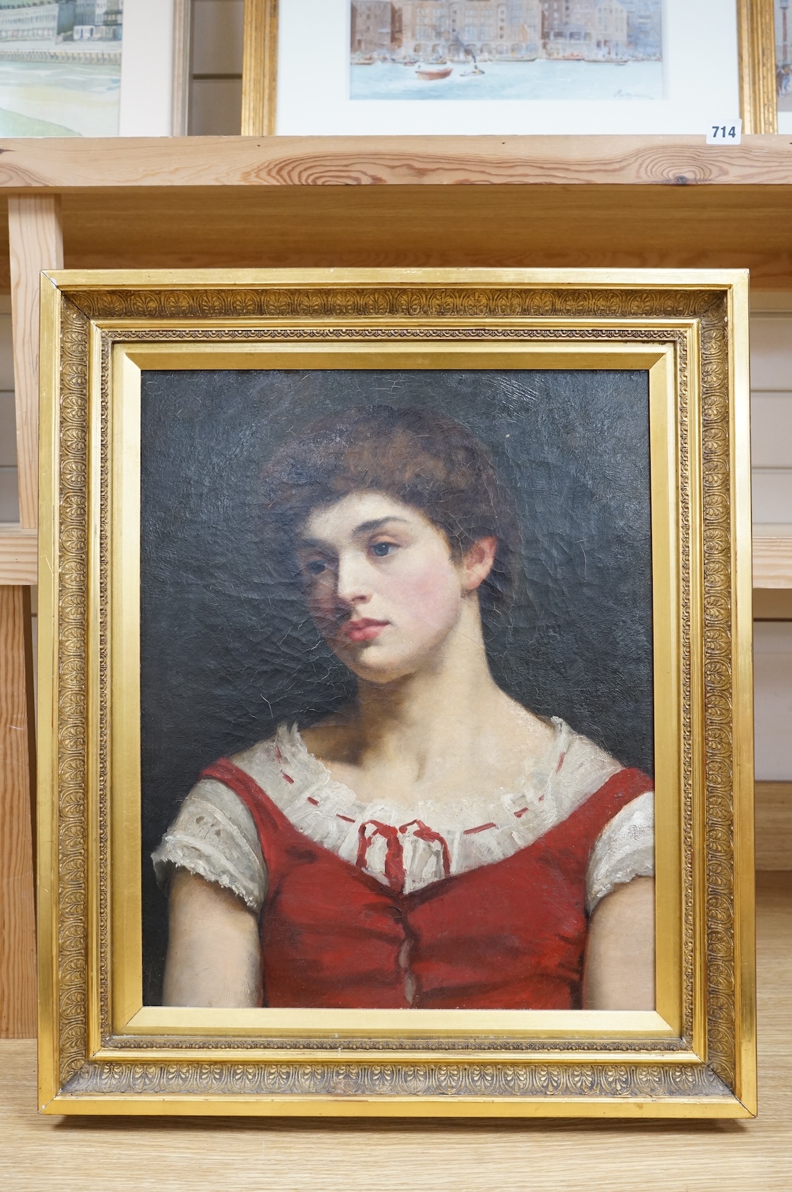 Late 19th / early 20th century School, Head and shoulders portrait of a young woman, unsigned, oil on canvas, 52 x 42cm, ornate gilt frame